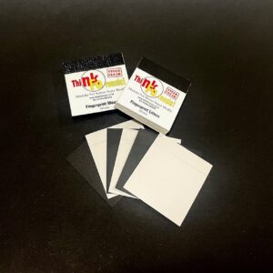 Low-tack adhesive lifter sheets for lifting fingerprints from smooth, non-porous surfaces, used with fingerprint powder and mounted on black backing cards